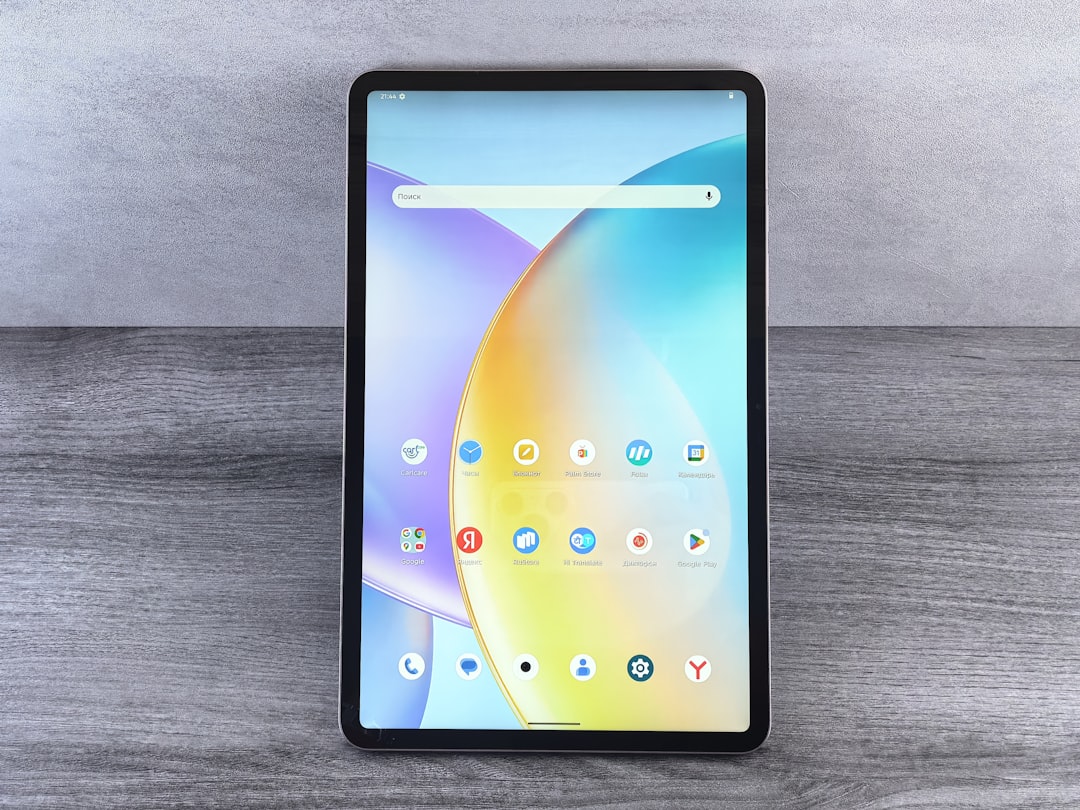 services-03 a-tablet-displaying-a-colorful-abstract-wallpaper-ztqw9c0ma7q